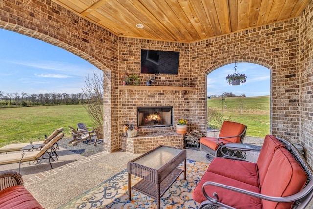 view of patio / terrace with an outdoor brick fireplace