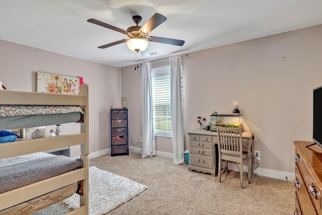 bedroom featuring light carpet and ceiling fan