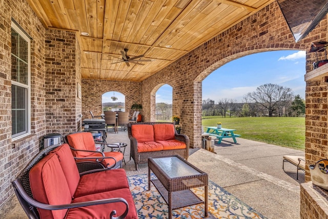 view of patio with an outdoor hangout area and ceiling fan