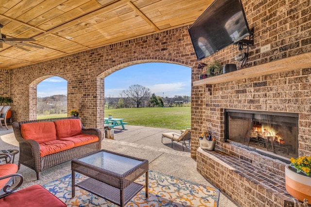 view of patio / terrace featuring an outdoor living space with a fireplace