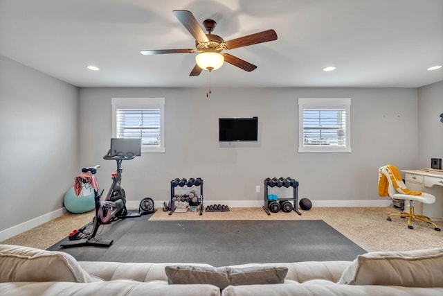 exercise room with carpet floors and ceiling fan