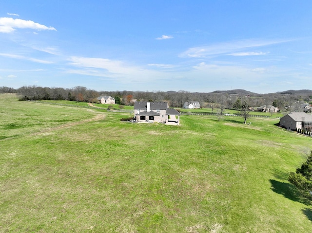 view of yard featuring a mountain view and a rural view