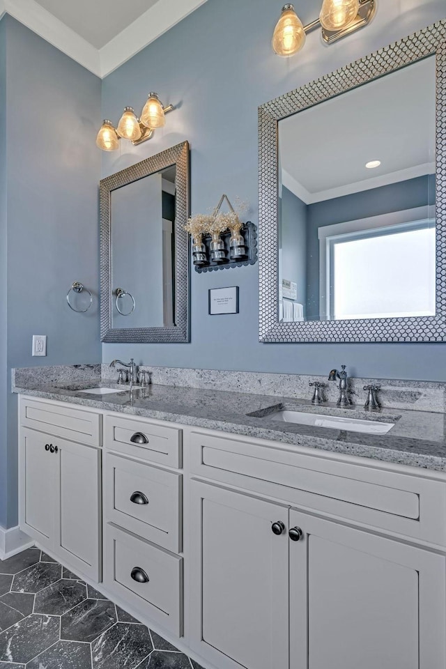 bathroom with ornamental molding and vanity