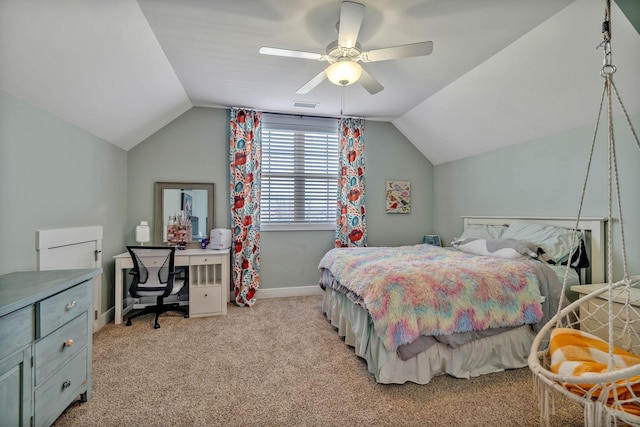 bedroom featuring light carpet, vaulted ceiling, and ceiling fan