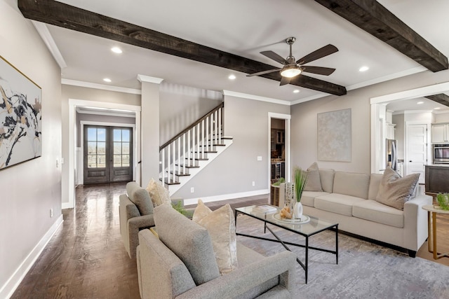 living room featuring wood-type flooring, ornamental molding, ceiling fan, beam ceiling, and french doors