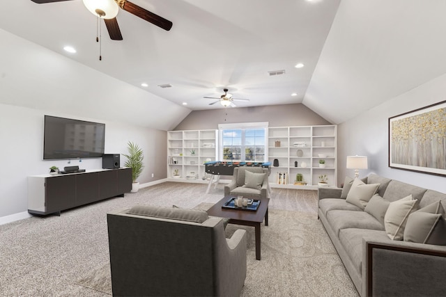 living room featuring ceiling fan, built in features, lofted ceiling, and light carpet