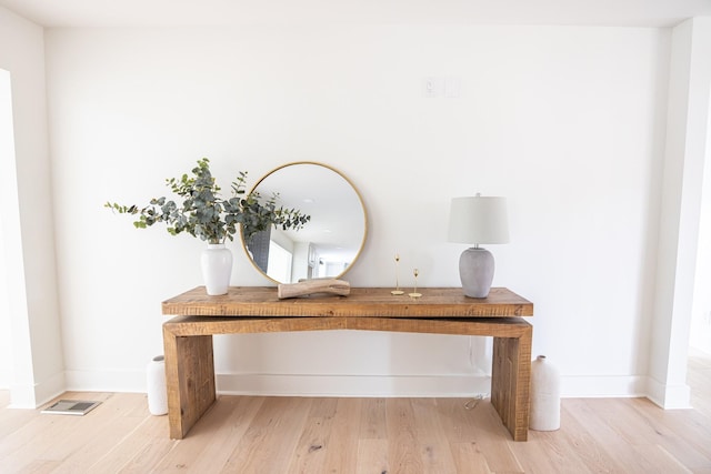 details featuring wood finished floors and baseboards