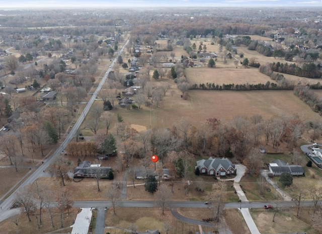 birds eye view of property featuring a rural view