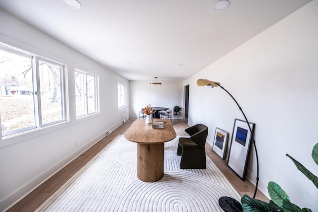 interior space featuring recessed lighting, wood finished floors, and baseboards