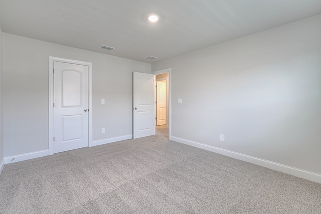 unfurnished bedroom featuring carpet