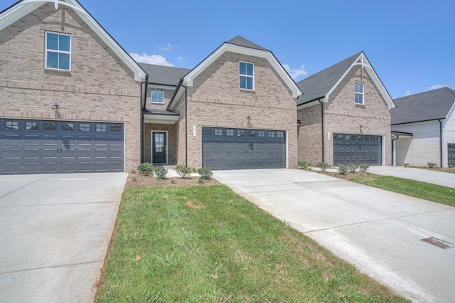 view of front facade with a garage and a front yard