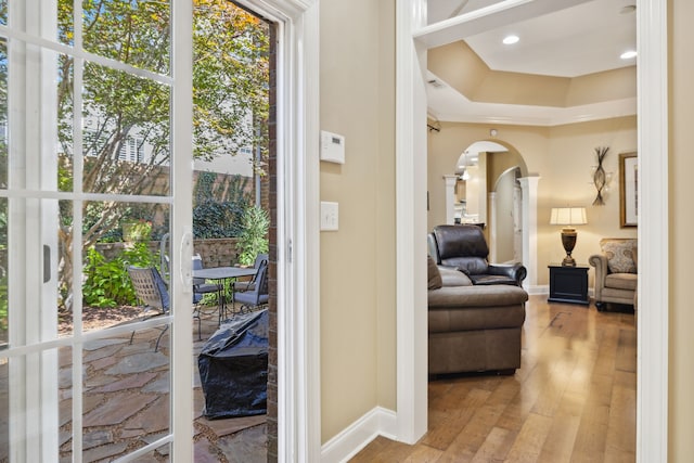 doorway to outside with wood-type flooring and a healthy amount of sunlight