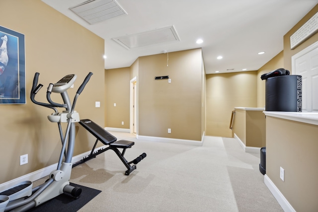 exercise room with light colored carpet