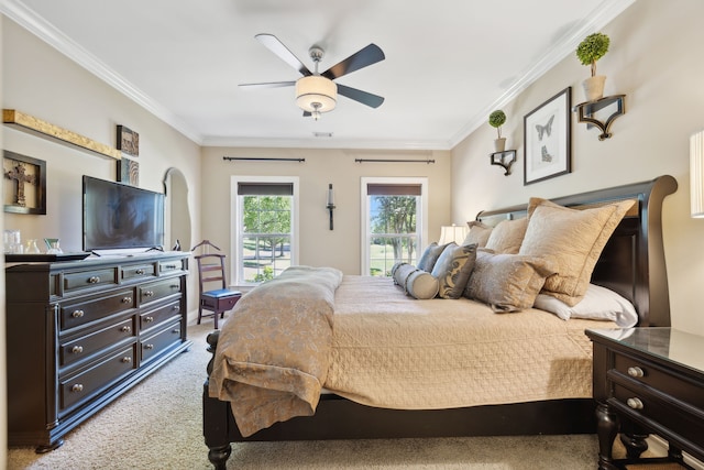 carpeted bedroom featuring crown molding, ceiling fan, and access to outside