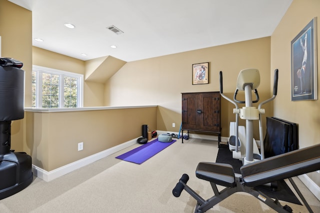 workout area featuring light colored carpet