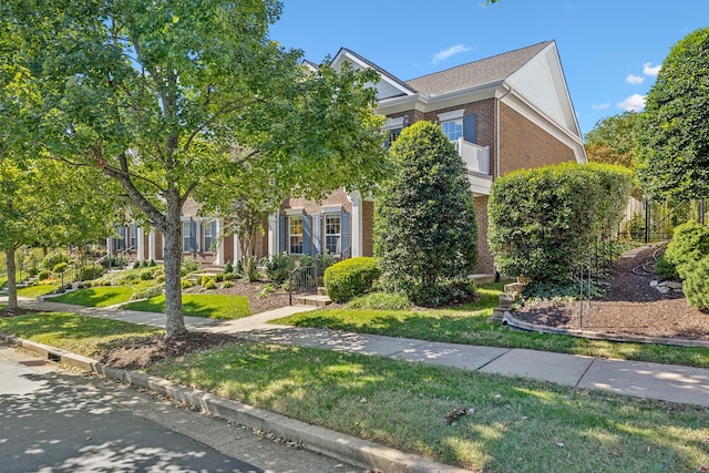 obstructed view of property featuring a front yard