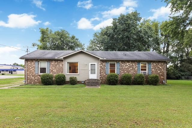 single story home with a front lawn