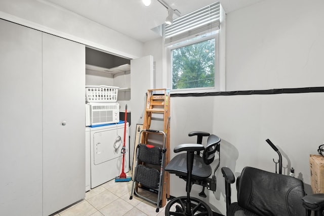 interior space with washer / clothes dryer, rail lighting, and light tile patterned floors