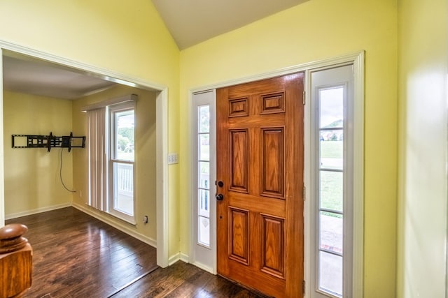 foyer featuring dark hardwood / wood-style floors and vaulted ceiling