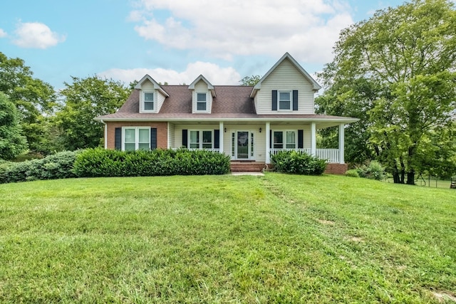 view of front of property with a front yard and a porch