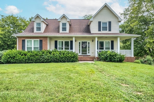 view of front facade with a front yard and covered porch