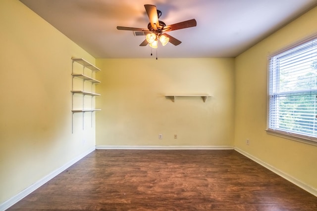 unfurnished room featuring ceiling fan and dark hardwood / wood-style flooring