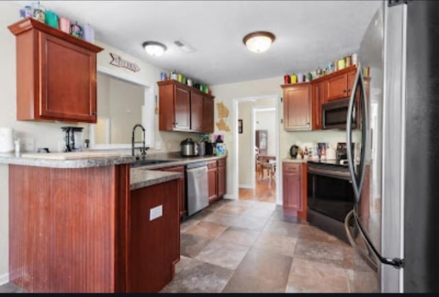 kitchen with appliances with stainless steel finishes and sink