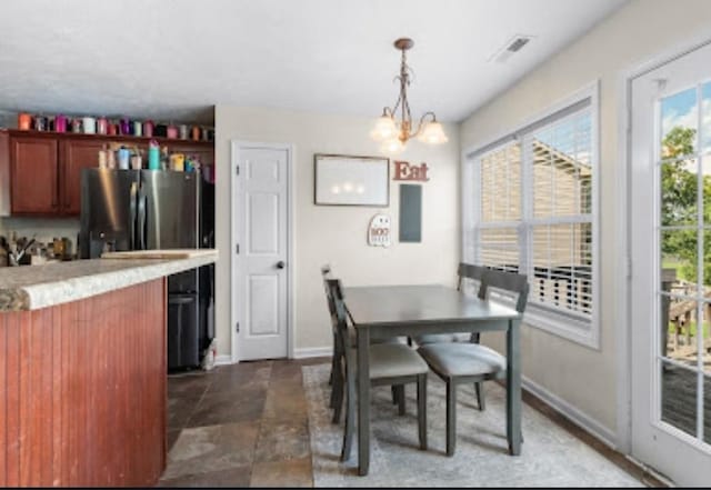 dining space featuring a chandelier