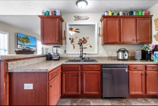 kitchen with dishwasher, plenty of natural light, sink, and light stone counters