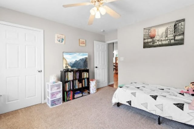 bedroom with ceiling fan and carpet