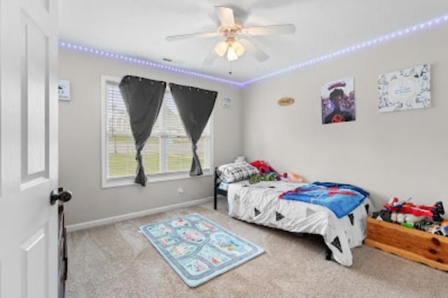 carpeted bedroom with ceiling fan