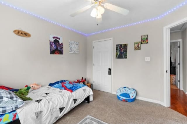 bedroom with ornamental molding, carpet, and ceiling fan