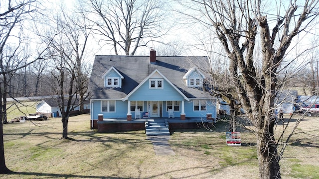 cape cod house featuring a porch