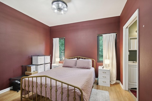 bedroom with light hardwood / wood-style flooring