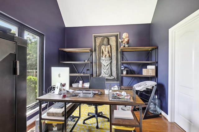 office featuring hardwood / wood-style flooring and vaulted ceiling