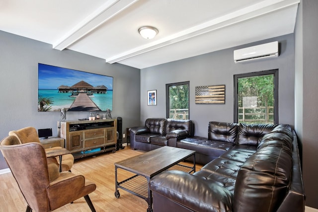 living room with beamed ceiling, wood-type flooring, and a wall mounted AC