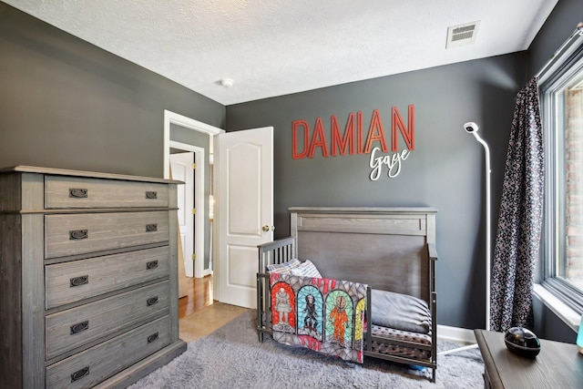 bedroom featuring a textured ceiling