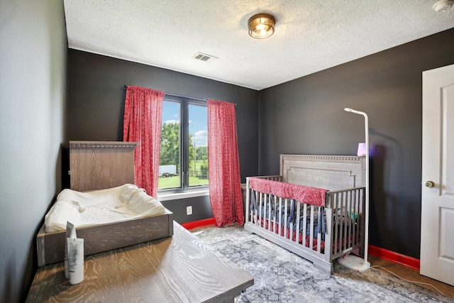 bedroom featuring a textured ceiling