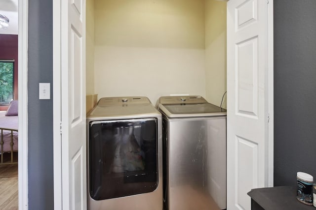 laundry room featuring washing machine and dryer