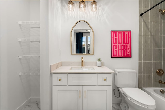 full bathroom featuring vanity, tiled shower / bath combo, and toilet