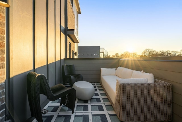 view of balcony at dusk