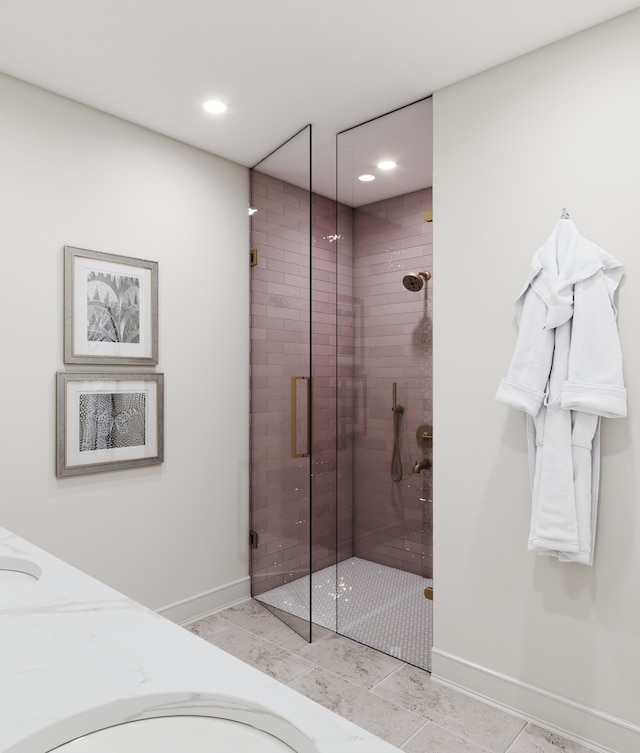 bathroom featuring an enclosed shower and tile patterned floors