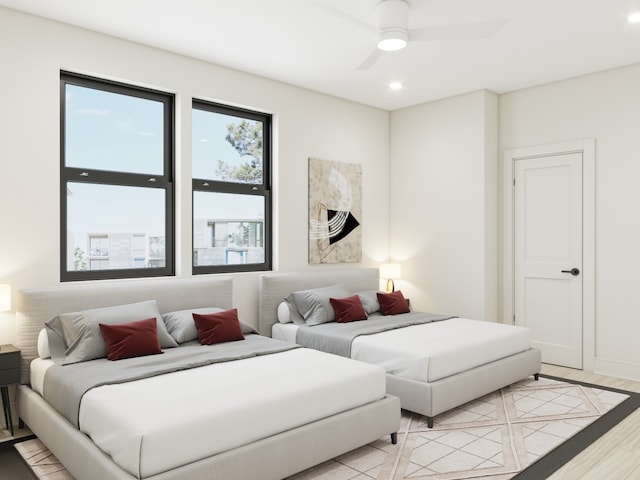 bedroom featuring ceiling fan and light hardwood / wood-style flooring