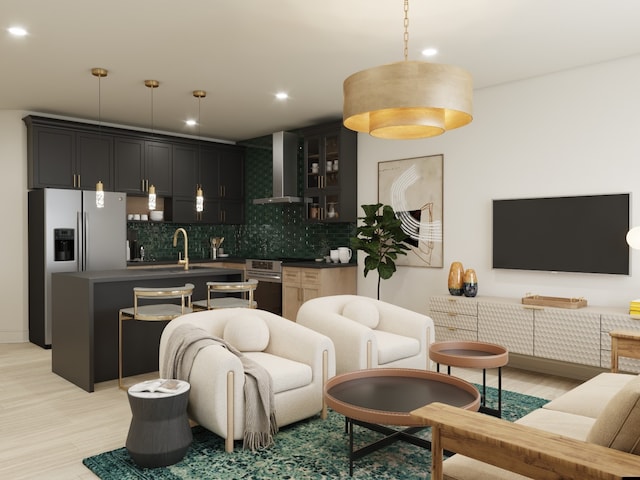 living room with sink and light hardwood / wood-style flooring