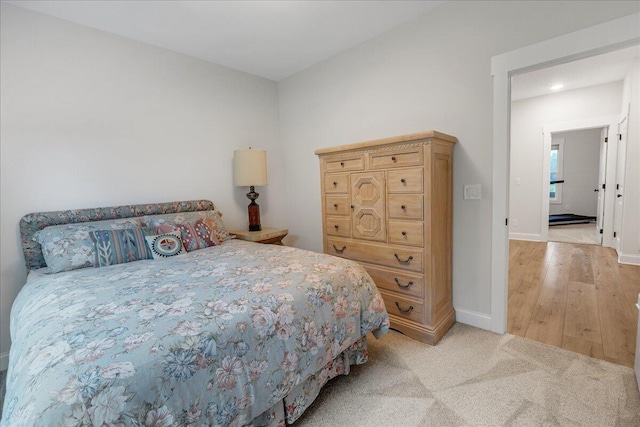 bedroom with light carpet