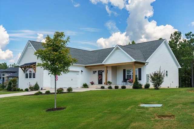 view of front of property with a garage, covered porch, and a front lawn