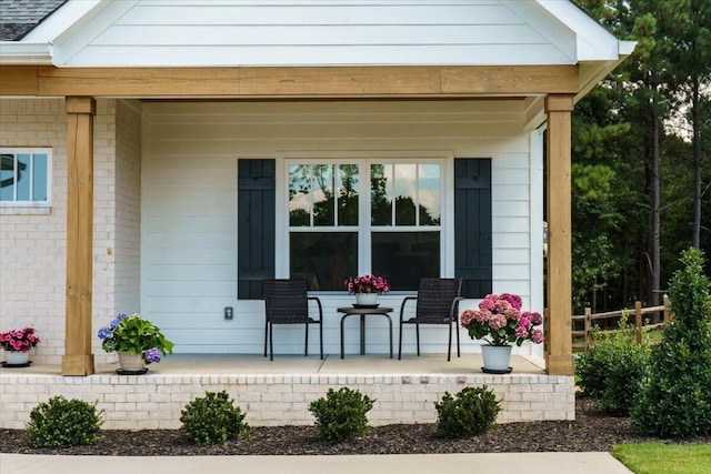 entrance to property featuring covered porch