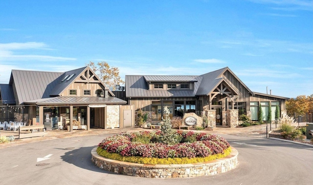 view of building exterior featuring curved driveway