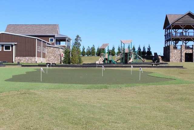 view of community with a lawn and a playground