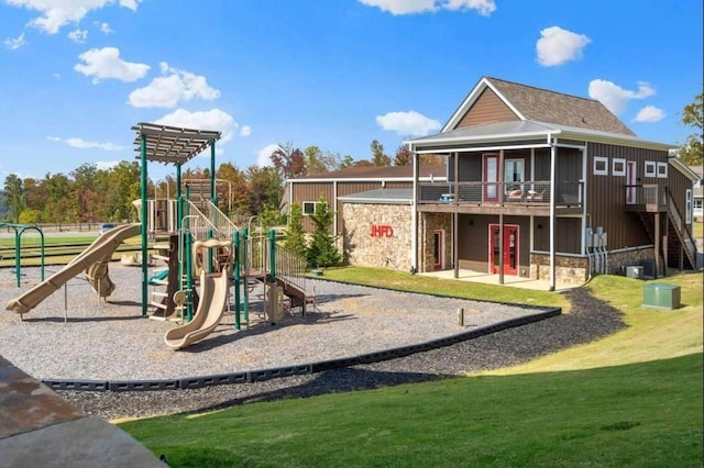 view of playground with a lawn